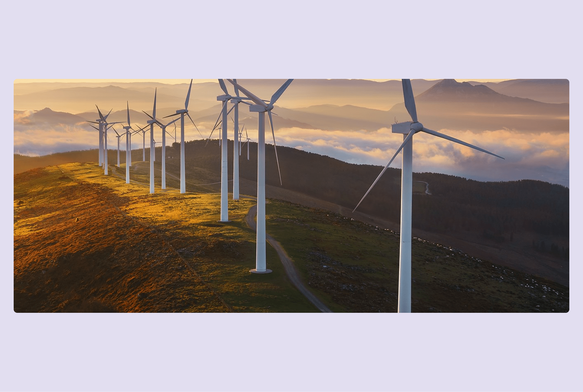 Wind farm in a mountain with the sun rising