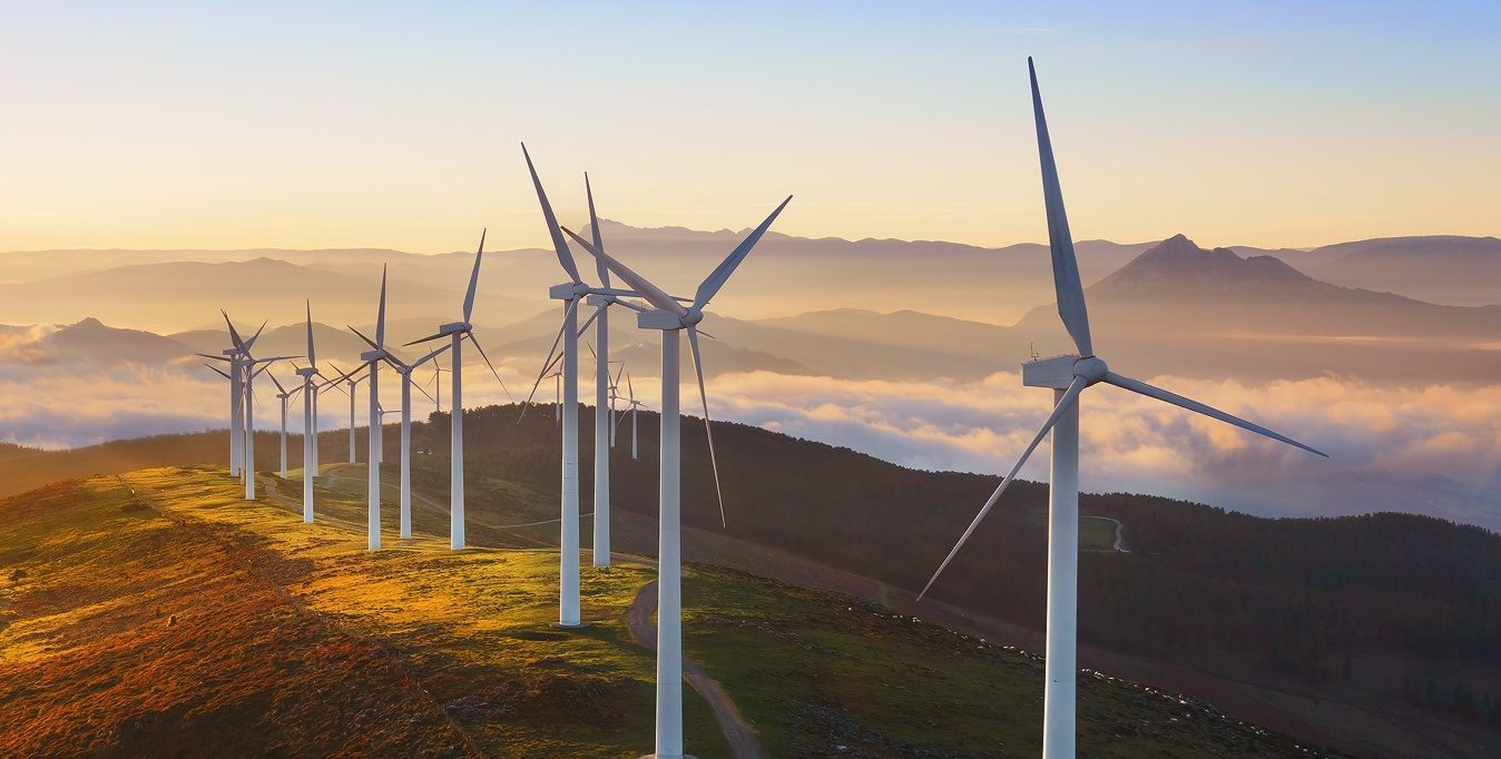 Wind Park with sun rising in a mountain