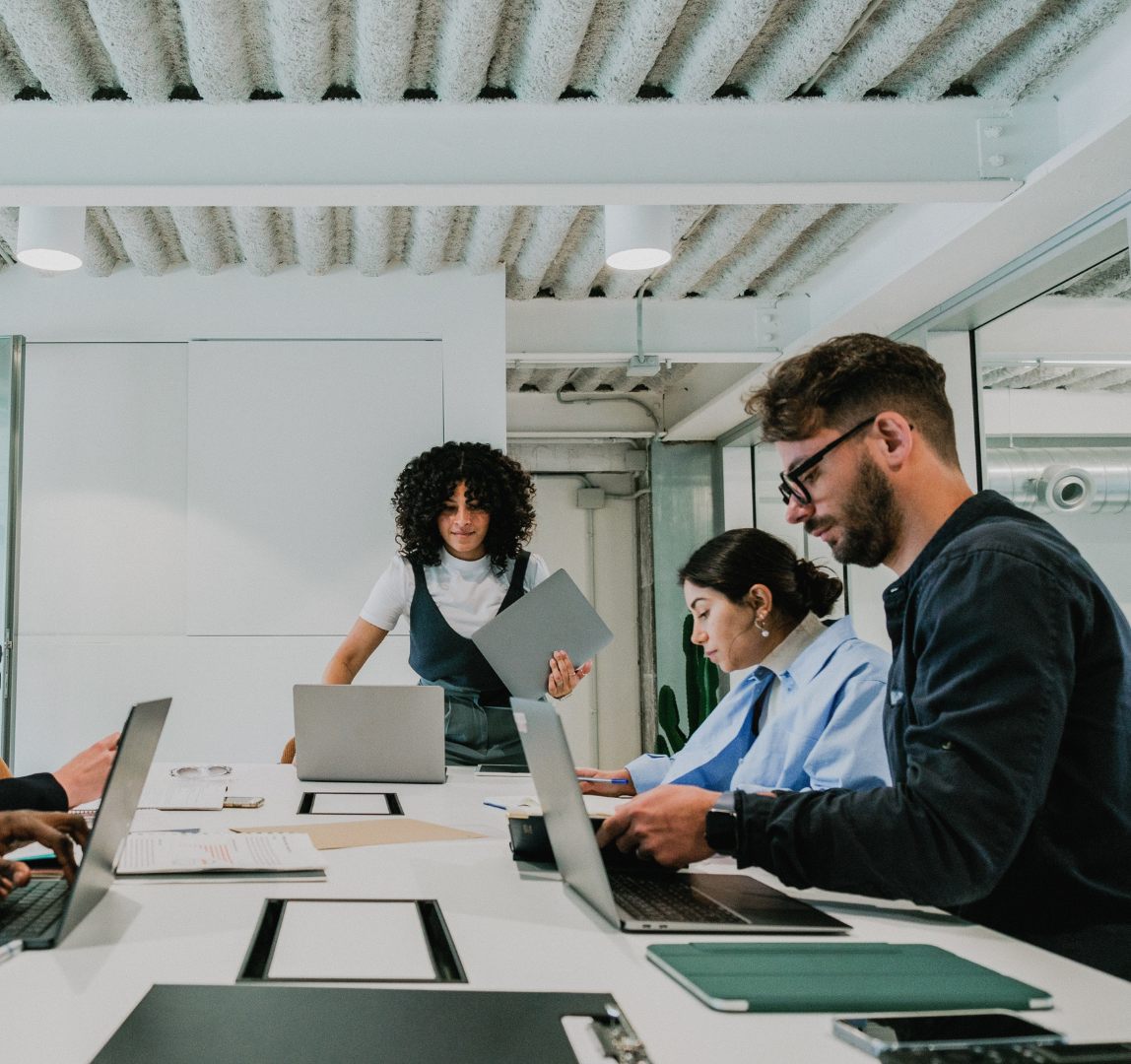 People working in an office with laptops